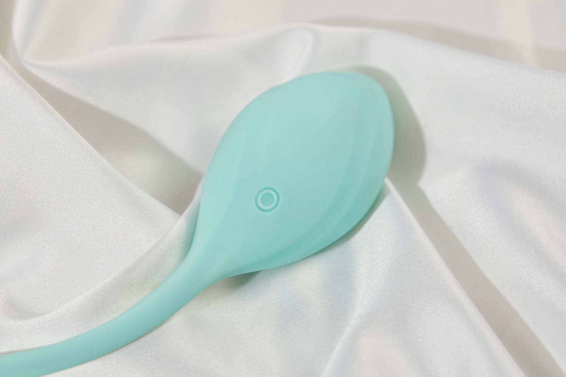 A young couple standing together indoors, holding a vibrator, symbolizing modern intimacy and reconnection