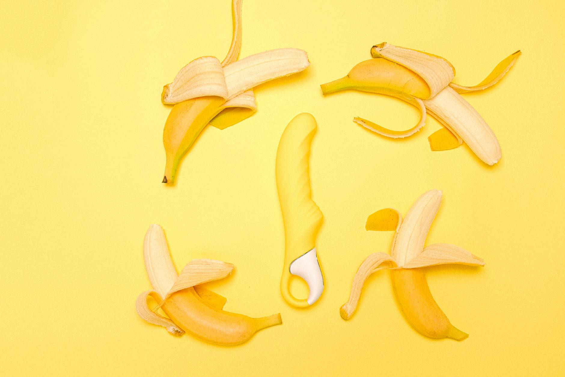 A yellow lemon vibrator arranged thoughtfully against a bright background, symbolizing intentional pleasure.